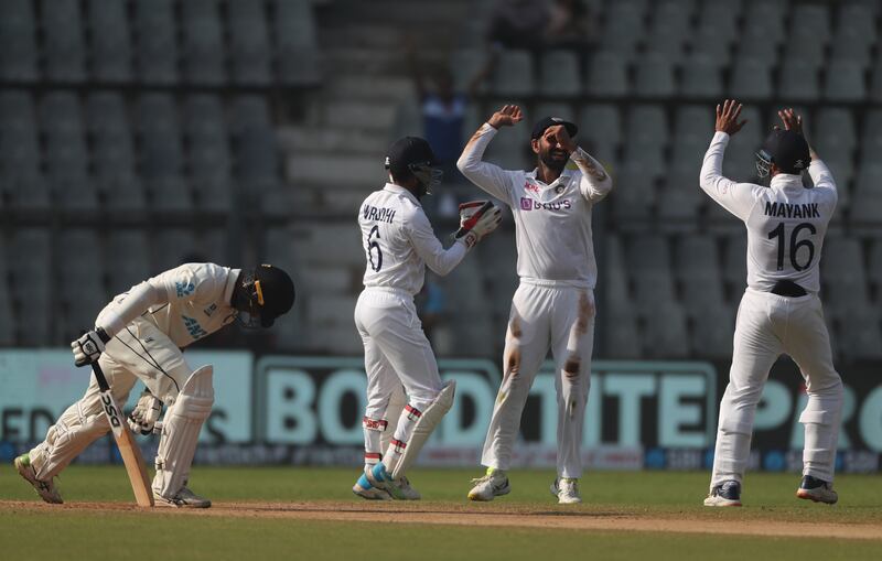 India players celebrate the dismissal of New Zealand's Rachin Ravindra. AP