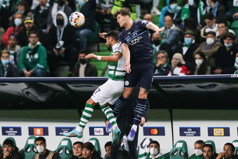 Sporting's Ricardo Esgaio and Manchester City's John Stones battle. EPA