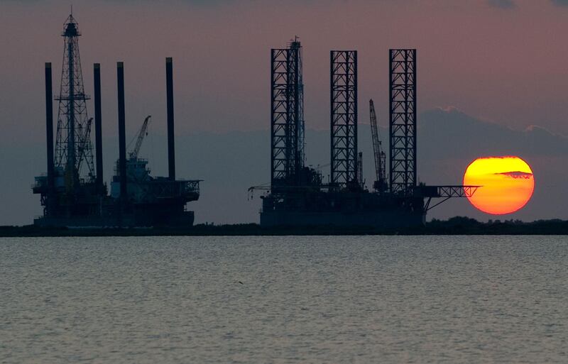 (FILES) In this file photo taken on June 13, 2010, the sun sets behind two offshore oil platform under construction in Port Fourchon, Louisiana. Stored in a complex of four underground sites along the coasts of the Gulf of Texas and Louisiana, the US strategic oil reserves are currently 660 million barrels for a total storage capacity of 727 million barrels. The US government plans to sell between 5 and 30 million barrels of oil from these strategic reserves (SPR), according to Bloomberg. / AFP / Saul LOEB / TO GO WITH AFP STORY by Ali BEKHTAOUI, "Strategic oil reserves, a multipurpose weapon"
