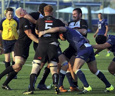 Dubai, March 23, 2018: Jebel Ali Dragons (BLUE) and Dubai Exiles (BLACK)  in cation during the West Asia Cup  Semi Finals at the Jebel Ali Centre of excellence grounds in Dubai. Satish Kumar for the National/ Story by Paul Radley