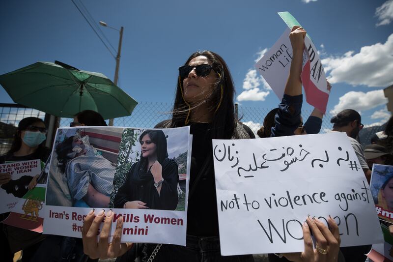 Protesters at a demonstration outside the Iranian embassy in Quito, Ecuador. EPA