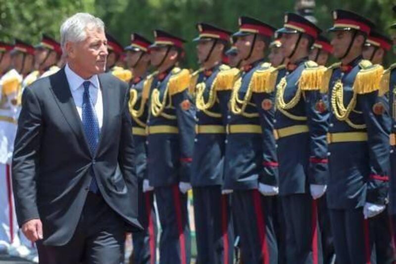 US secretary of defence Chuck Hagel inspects Egyptian troops during an arrival ceremony at the ministry of defence in Cairo yesterday. He arrived in Abu Dhabi last night. Jim Watson /Getty Images
