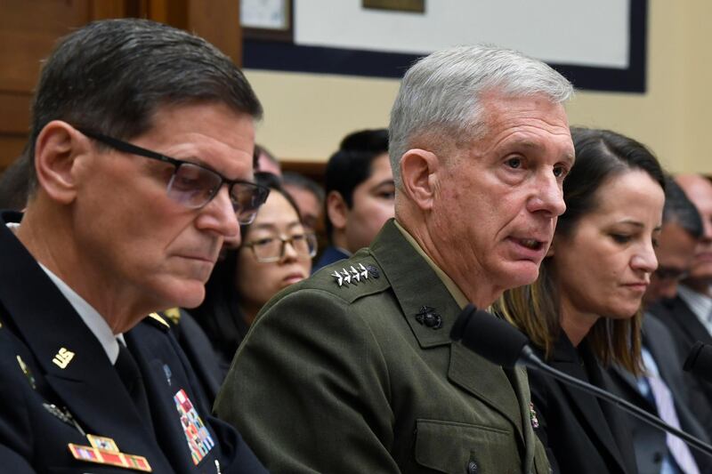 U.S. Africa Command Commander Gen. Thomas Waldhauser, center, flanked by U.S. Central Command Commander Gen. Joseph Votel, left, and Acting Assistant Secretary of Defense for International Security Affairs Kathryn Wheelbarger, right, testifies before the House Armed Services Committee on Capitol Hill in Washington, Thursday, March 7, 2019. (AP Photo/Susan Walsh)