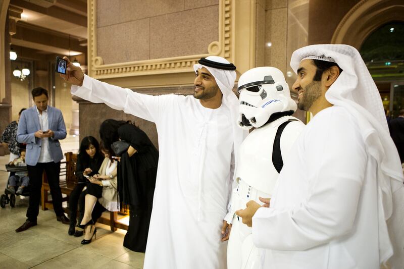 A pair of Emirati men take a selfie with a stormtrooper ahead of the Star Wars: The Force Awakens, Middle East premiere at Emirates Palace in Abu Dhabi. Christopher Pike / The National