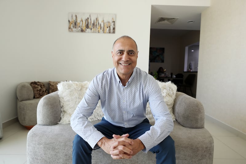 Yogesh Sharma's passive investments generate income that exceeds his annual spending. Chris Whiteoak / The National