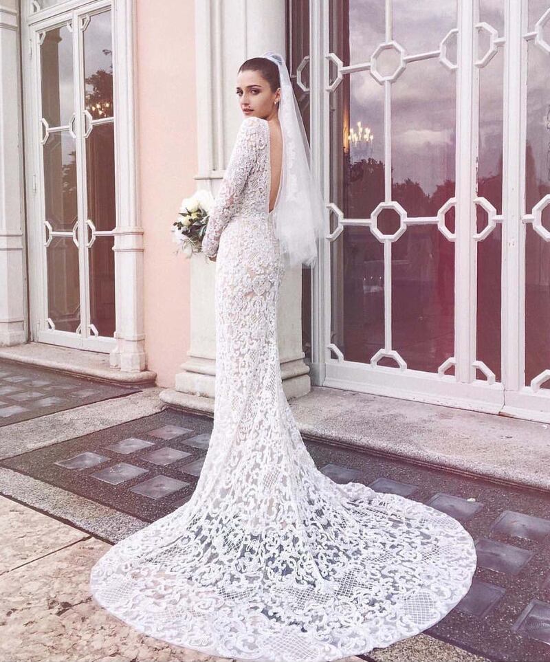 For her 2016 wedding to hairstylist Paolo Soffiatti, Italian fashion blogger Eleonora Carisi wore an open backed, long-sleeved, embroidered lace gown by Elie Saab. Photo: Eleonora Carisi