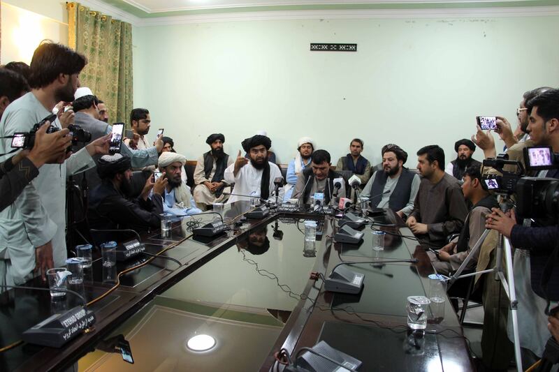 Ahmadullah Muttaqi, the Taliban's director for information and culture, talks to journalists after the government in Kandahar had surrendered to the militants. EPA