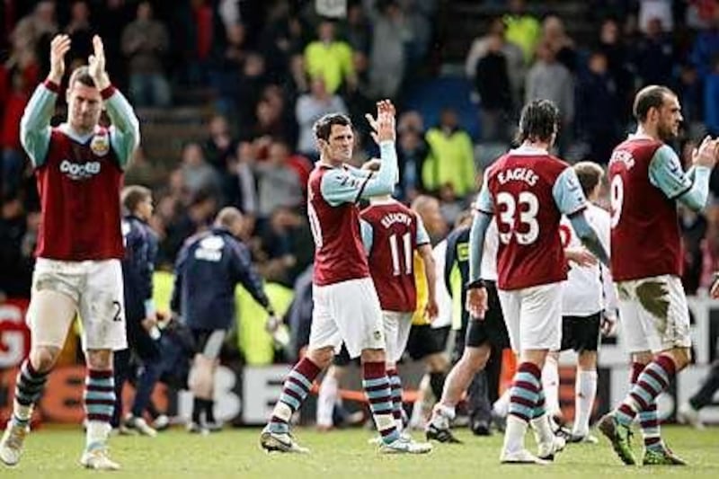 Burnley players applaud their loyal fans after a 4-0 loss to Liverpool in April sealed their relegation to the Championship.