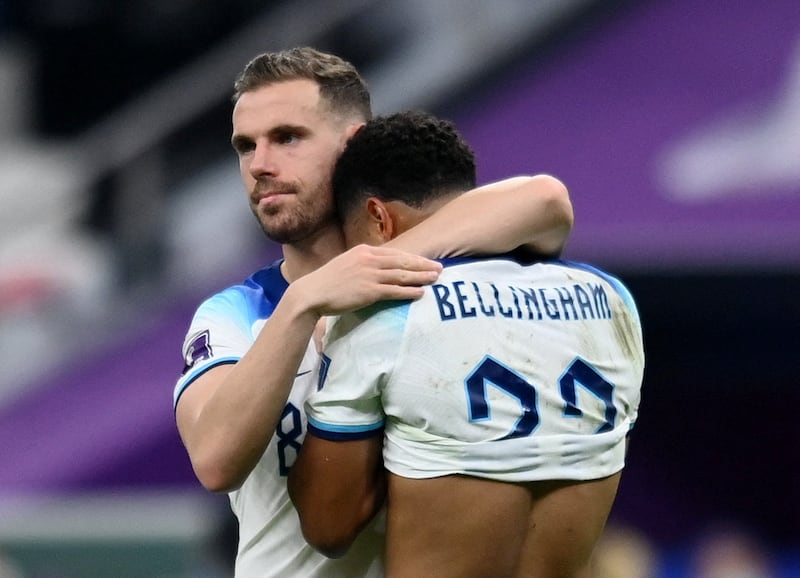 Soccer Football - FIFA World Cup Qatar 2022 - Quarter Final - England v France - Al Bayt Stadium, Al Khor, Qatar - December 11, 2022 England's Jordan Henderson and Jude Bellingham look dejected after the match as England are eliminated from the World Cup REUTERS / Annegret Hilse