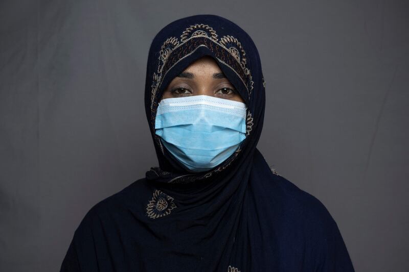 Seamstress Rozia Khpalwak, 23, poses for a portrait in Kandahar.