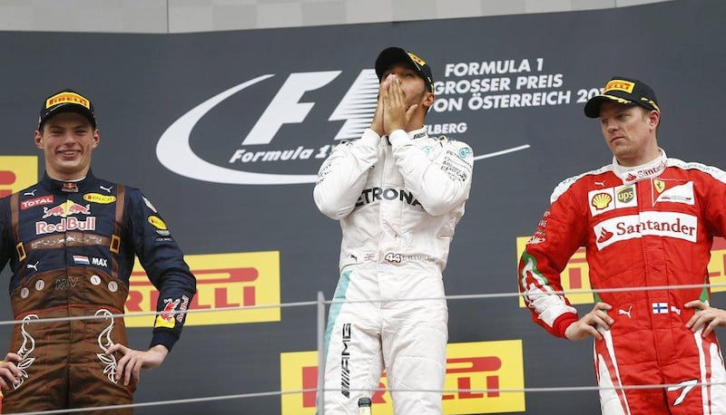 Mercedes driver Lewis Hamilton flanked by Red Bull’s Max Verstappen and Ferrari’s Kimi Raikkonen pose after the Formula One Austrian Grand Prix. Dominic Ebenbichler / Reuters
