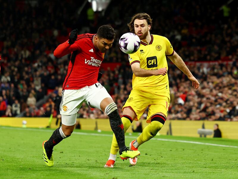 Manchester United midfielder Casemiro and Sheffield United's Ben Brereton Diaz battle for the ball. Reuters