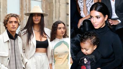 Left, Camila Alves McConaughey took her son Levi and daughter Vida to Paris Fashion Week; right, Kim Kardashian attended the Balenciaga spring/summer 2015 show with her then 15-month-old daughter, North. Getty Images