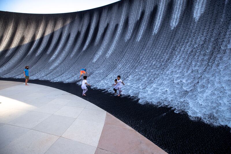 Children enjoy the Expo 2020 Dubai water feature. Victor Besa / The National.
