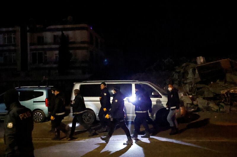 People walk outside after an earthquake in Antakya in Hatay province, Turkey.