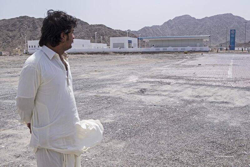 Akim Khan looks at the area of the Friday Market at Masafi, Fujairah, that was gutted by fire a month ago. “We lost huge amounts of money, almost Dh15m, and 50 passports,” he says.  Antonie Robertson / The National 