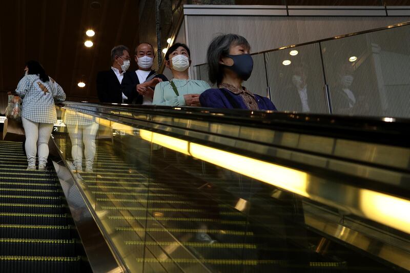 A near-empty rush-hour escalator in Osaka, Japan. A surge in Covid-19 cases in Osaka prefecture caused overwhelming demand for hospital beds as the area struggles to cope with a fourth wave of coronavirus. Getty Images
