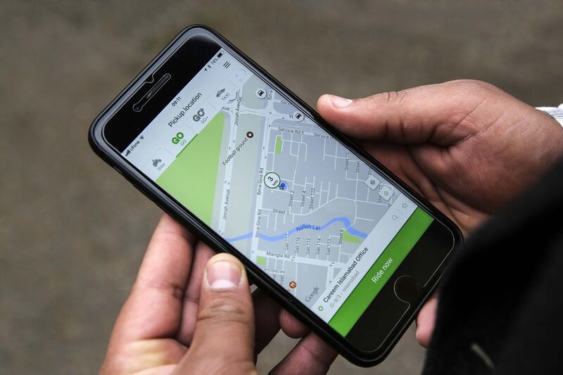 A customer displays the Careem Inc. ride-hailing app while booking a car in this arranged photograph in Islamabad, Pakistan, on Tuesday, Dec. 12, 2017. Ride-hailing company Careem plans to expand across as many as 30 new cities in Pakistan as it taps into the country's growing middle-class. Photographer: Asad Zaidi/Bloomberg