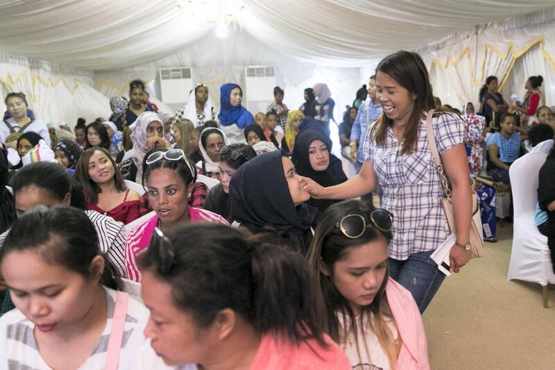 ABU DHABI, UNITED ARAB EMIRATES - AUGUST 5, 2018. 

“All people don’t know we are sad. A smile is hiding all.” says  Maulida “Ina”, 30, right, from Indonesia. Ina is seeking amnesty today at Al Shahama immigration centre in Abu Dhabi.

Thousands of undocumented workers streamed into the center today as they sought to take advantage of the government's new amnesty law. 
 
(Photo by Reem Mohammed/The National)

Reporter: Anna Zacharias
Section:  NA