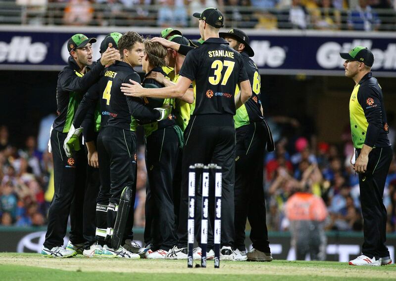 Australia celebrate the wicket of K.L. Rahul, not shown, during the first T20 International cricket match between Australia and India in Brisbane, Australia, Wednesday, Nov. 21, 2018. (AP Photo/Tertius Pickard)