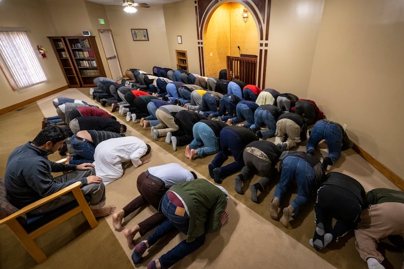 Worshippers take part in Friday prayers at the mosque. AP photo