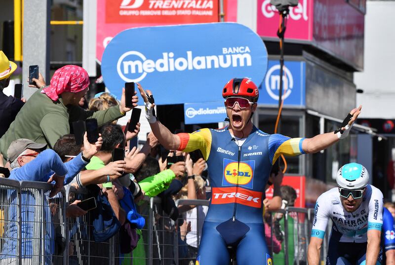Lidl-Trek rider Jonathan Milan celebrates winning Stage 4 of the Giro d'Italia ahead of Team Alpecin's Kaden Groves and Phil Bauhaus of Team Bahrain on May 7, 2024. Reuters