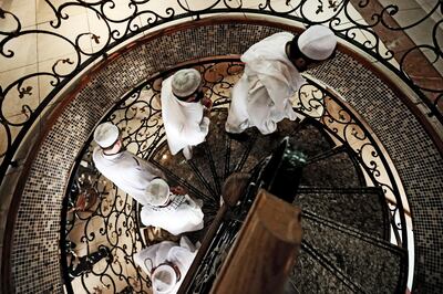 Abu Dhabi, United Arab Emirates, August 12, 2014:     A group of men walk up the staircase prior to eating lunch at the Al Ibrahimi restaurant off Electra street in downtown Abu Dhabi on August 12, 2014. Christopher Pike / The National

Reporter:  N/A
Section: News

For possible focal point