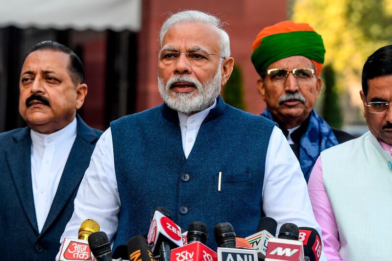 India's Prime Minister Narendra Modi (2L) speaks to media representatives as he arrives to attend the budget session of Parliament in New Delhi on January 31, 2020. / AFP / Prakash SINGH
