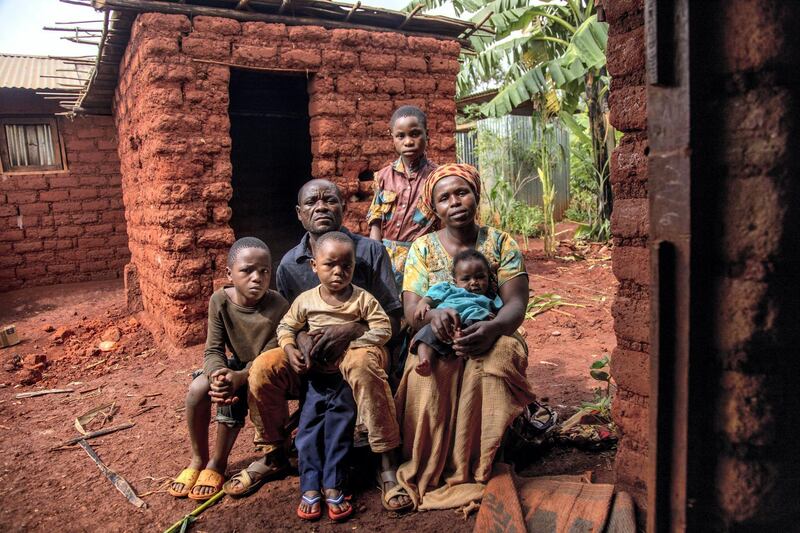 STRICTLY NO USE BEFORE 05:00 GMT (09:00 UAE) 18 JUNE 2020


Burundian refugee Nyamoza Rachel, 24, sits with her husband and children outside her kitchen that was built to house a new stove design for refugees in Nyarugusu camp. ; Rachel uses two types of stove: the mud-brick stove and the inert stove. Inert stoves were distributed to refugees in Tanzania to reduce the amount of wood required for each meal, in line with efforts to protect the forests and environment. The stoves are made by refugees themselves and use 50 per cent less firewood with less indoor smoke pollution. The project has reduced sexual and gender-based violence risks for the women who have to leave the camp to collect firewood. Nyarugusu hosts around 150,000 refugees, of which 65,000 come from Burundi and the rest from the Democratic Republic of the Congo.