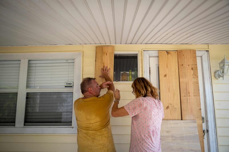 Florida residents Danny Aller and his wife Karen prepare for the storm. AFP