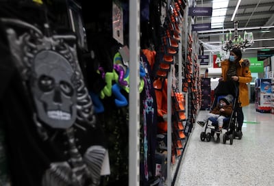 A customer looks at the Halloween costumes in the UK supermarket Asda, as the store launches a new sustainability strategy, in Leeds, Britain, October 19, 2020. Picture taken October 19, 2020. REUTERS/Molly Darlington