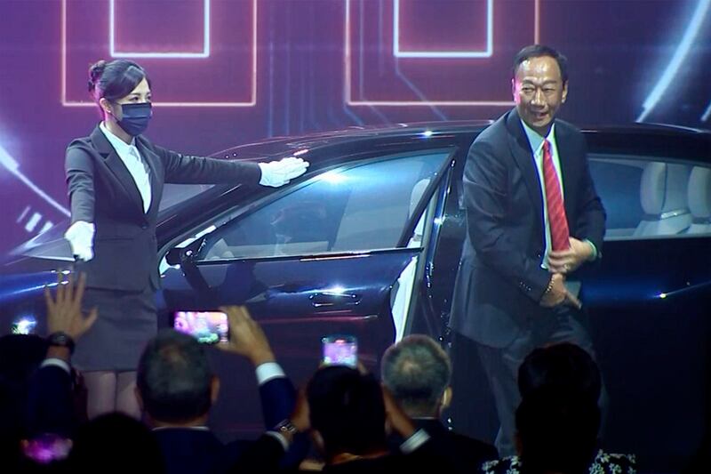 Foxconn founder Terry Gou, right. The Taiwanese company that manufactures smartphones for Apple and other global brands has big plans to produce electric cars under a similar contract model. AP