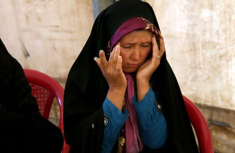  Afghan deportee, Tajigul Haidary, 26, right, is at the Afghanistan-Iranian border point, on the outskirts of Islam Qala in Herat province in Afghanistan hoping to return to Iran where her husband and children are. Haidary had overstayed her residents' visa in Iran and was expecting just a hefty fine but was instead deported as an illegal immigrant. Massoud Hossaini/AP Photo