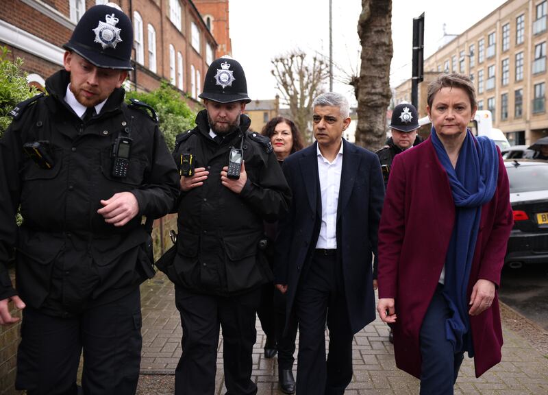 Mr Khan and shadow home secretary Yvette Cooper accompany police officers in Earlsfield, south London. Getty Images