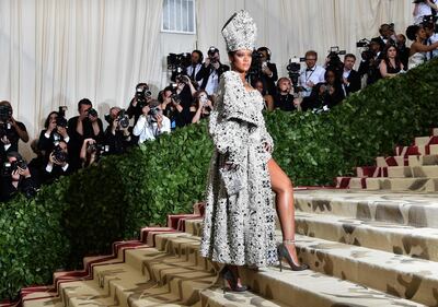 (FILES) In this file photo taken on May 8, 2018 Rihanna arrives for the 2018 Met Gala at the Metropolitan Museum of Art in New York. Pop idol Rihanna is preparing to launch her own luxury brand with the world's biggest fashion conglomerate. According to Women's Wear Daily (WWD), Rihanna is in secret talks with the French giant LVMH. / AFP / Hector RETAMAL
