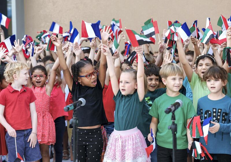 Abu Dhabi, United Arab Emirates, October 28, 2019.  
French Minister for Europe and Foreign affairs, Mr. Jean-Yves Le Drian, inaugurates the new premises of the primary school of the Lycée Louis Massignon Abu Dhabi.
--  Students raise the U.A.E. and French flag after singing both national anthems.
Victor Besa/The National
Section:  NA
Reporter: John Dennehy
