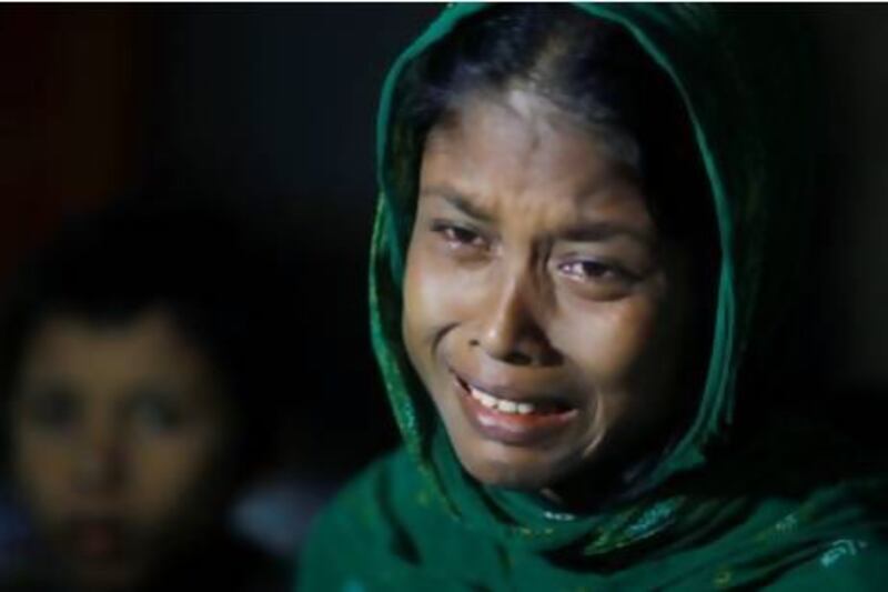 A Rohingya Muslim woman whose husband was allegedly killed in Myanmar, cries as she waits with others to be sent back to Myanmar at a camp of Border Guards of Bangladesh or BGB, in Taknaf, Bangladesh, Friday, June 22, 2012. Bangladesh turned back more than 2,000 Rohingyas who tried to enter the country after the deadly violence between Rohingyas and ethnic Rakhine Buddhists erupted this month. (AP Photo/Saurabh Das)