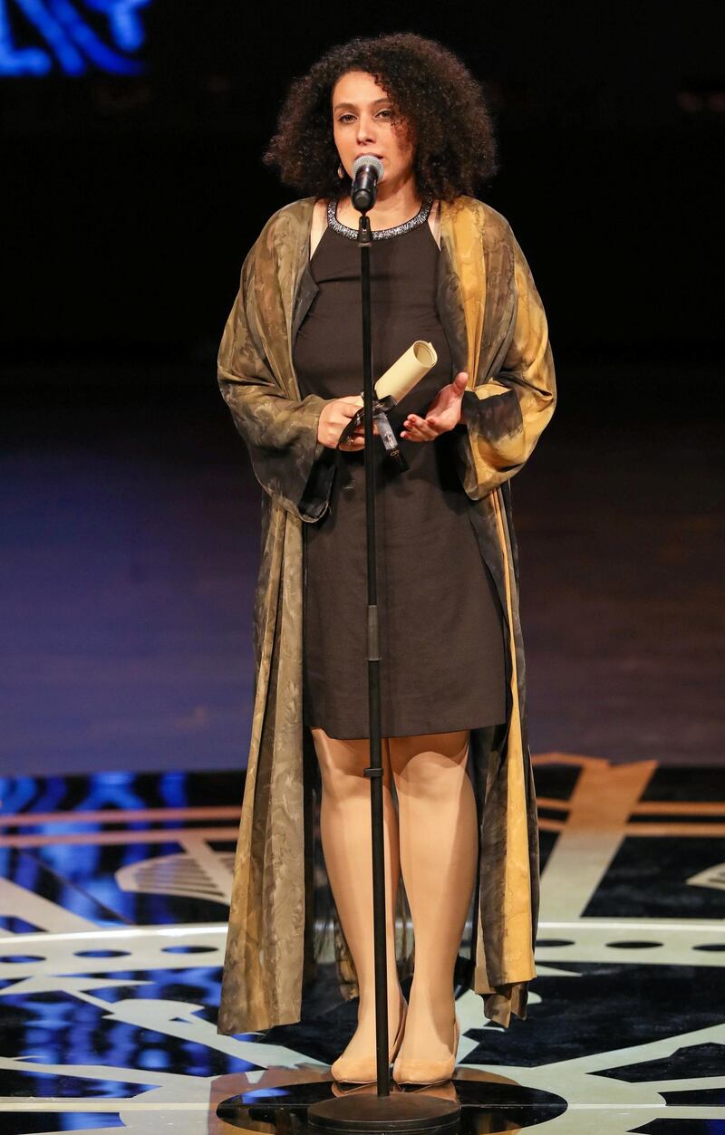 Director Nada Riyadh receives an award during the closing ceremony of the 41st Cairo International Film Festival. Reuters