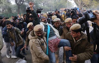 epa08091737 Indian Security personnel detain Indian student activists during a protest against alleged police brutality on protesters in Uttar Pradesh state, against the Citizenship Amendment Act (CAA) and the National Register of Citizens (NRC), outside the Uttar Pradesh Bhawan in New Delhi, India, 27 December 2019. The bill will give Indian citizenship rights to refugees from Hindu, Jain, Buddhist, Sikhs, Parsi or Christian communities coming from Afghanistan, Bangladesh and Pakistan.  EPA/RAJAT GUPTA