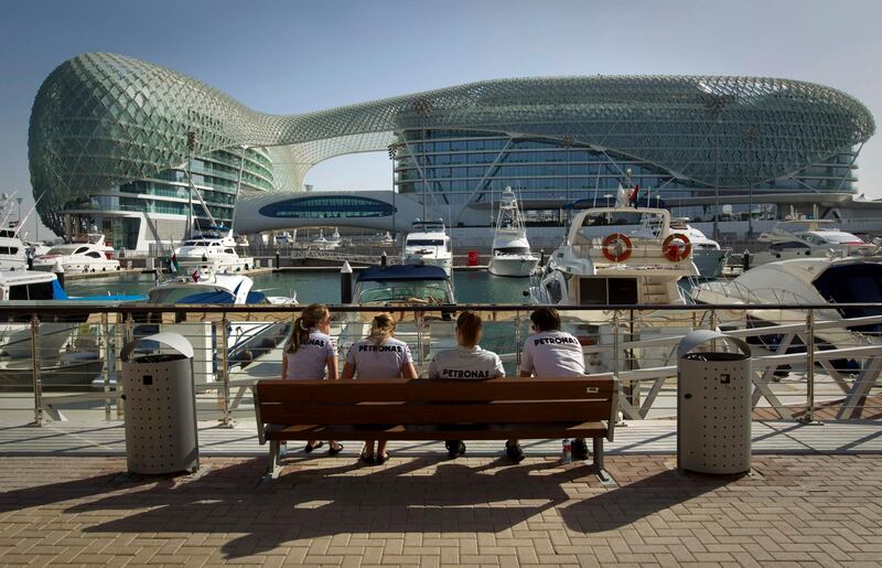 Staff of the Mercedes Formula One team take a lunch break ahead of the Abu Dhabi F1 Grand Prix at the Yas Marina circuit in Abu Dhabi November 10, 2011. REUTERS/Caren Firouz (UNITED ARAB EMIRATES - Tags: SPORT MOTORSPORT) *** Local Caption ***  CJF06_MOTOR-RACING-_1110_11.JPG