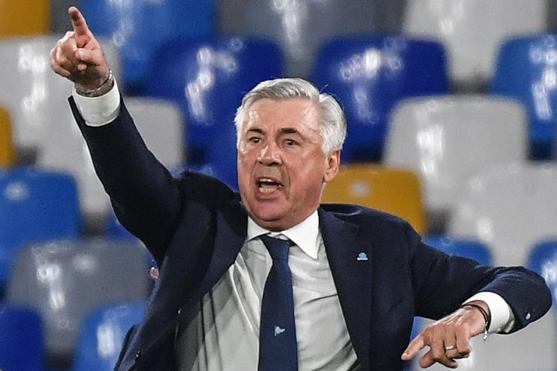 (FILES) In this file photo taken on September 25, 2019 Napoli's Italian head coach Carlo Ancelotti gestures as he shouts instructions during the Italian Serie A football match Napoli vs Cagliari at the San Paolo stadium in Naples. Carlo Ancelotti has reached "an agreement in principle" to become the next Everton manager, Sky Sports News reported Monday, December 16. / AFP / Andreas SOLARO
