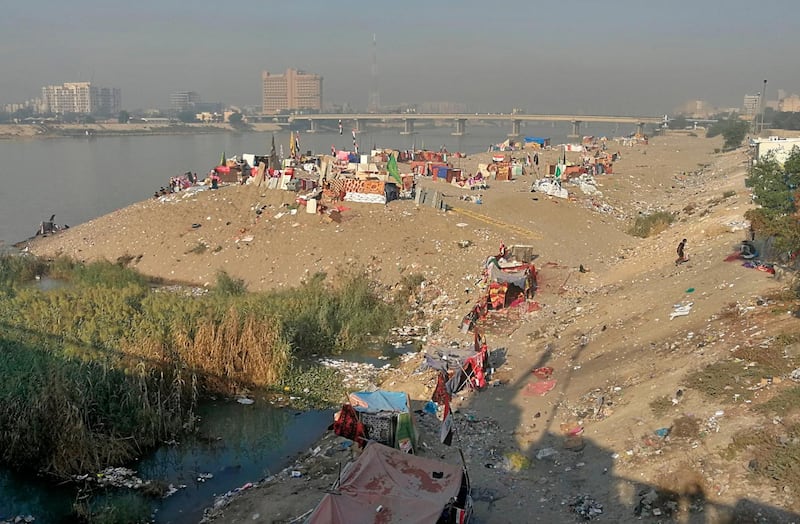 Anti-government protesters sit-in on the bank of the Tigris river during ongoing protests, in Baghdad, Iraq. AP Photo