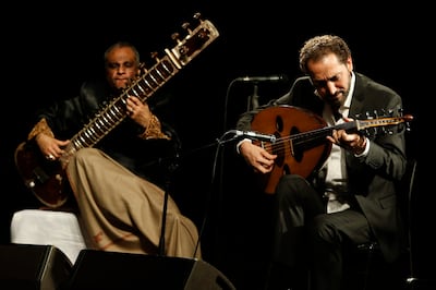 SHARJAH, UNITED ARAB EMIRATES, JANUARY 15, 2014. Naseer Shamma, the Iraqi Oud player, performs with Sitar Maestro Ashraf Sharif Kahn at the Al Qasba Theatre in Sharjah. (Photo: Antonie Robertson/The National) Journalist: Saeed Saeed. Section: Arts & Life.