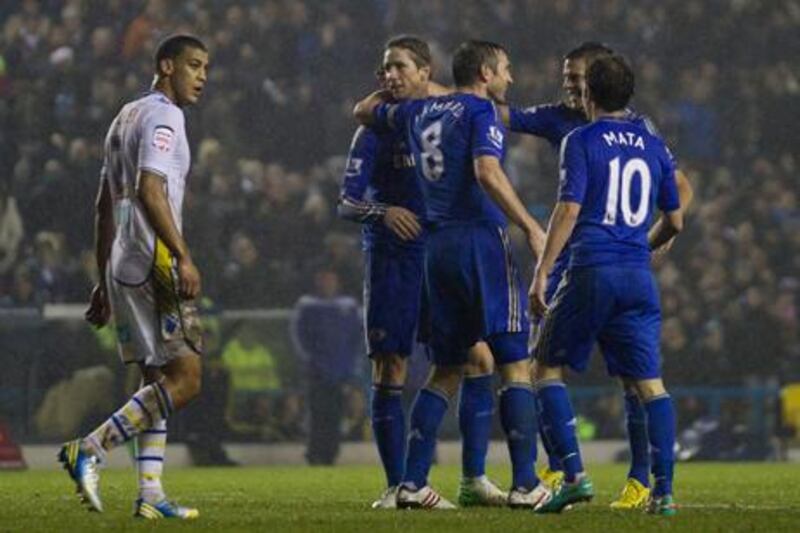 Chelsea players celebrate Fernando Torres' goal against Leeds in the English League Cup.