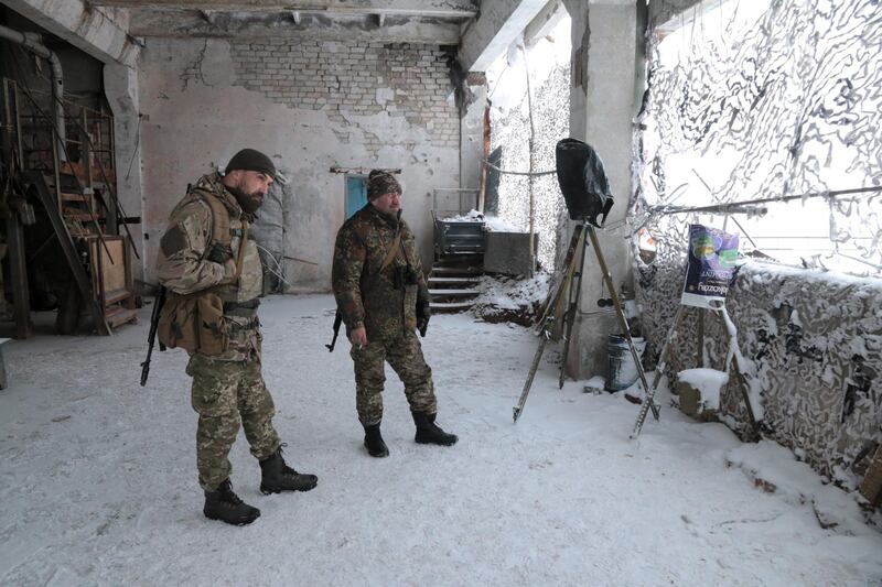 Ukrainian soldiers at an observation post on the roof of an abandoned factory overlooking separatist territory in Novoluhanske, eastern Ukraine. Florian Neuhof for The National