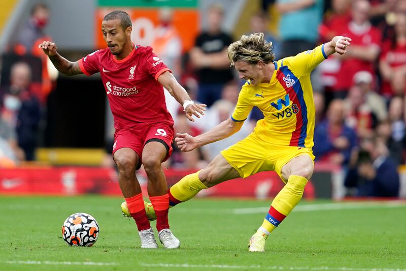 Crystal Palace midfielder Conor Gallagher attempts to tackle Liverpool's Thiago. AP