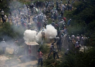 Indian police use tear gas to disperse farmers who were marching to the Indian capital after stopping them at New Delhi's border with neighboring Uttar Pradesh state, India, Tuesday, Oct.2, 2018. The farmers have been pressing for waiver of farm loans amid other demands. Rain-dependent agriculture employs more than half of Indiaâ€™s 1.3 billion people, but shrinking earnings mean it now accounts for only 15 percent of Indiaâ€™s economy. The bulk of Indian farmers are poor. (AP Photo)
