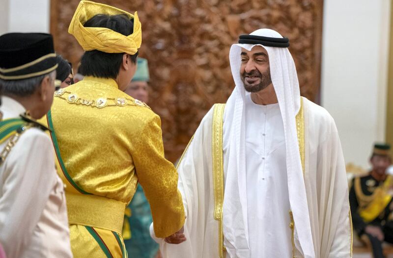 KUALA LUMPUR, MALAYSIA - July 30, 2019: HH Sheikh Mohamed bin Zayed Al Nahyan, Crown Prince of Abu Dhabi and Deputy Supreme Commander of the UAE Armed Forces (R) greets a guest during the inauguration of HM King Abdullah Ri’ayatuddin Al-Mustafa Billah Shah of Malaysia (not shown), at Istana Negara, the National Palace of Malaysia.

( Rashed Al Mansoori / Ministry of Presidential Affairs )
---