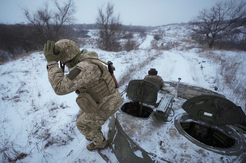 Ukrainian servicemen near the front-line position in the Luhansk area, eastern Ukraine. Oil prices drew support from concerns over a possible military conflict in Ukraine that could disrupt energy markets, especially natural gas supply to Europe. AP