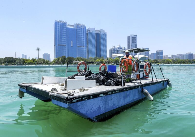 Abu Dhabi, United Arab Emirates, June 15, 2019.  
AUH clean up mission by volunteers at the Abu Dhabi Dhow Harbour. --  The trach barge docks at the harbour.
Victor Besa/The National
Section:  NA
Reporter:  Anna Zacharias
